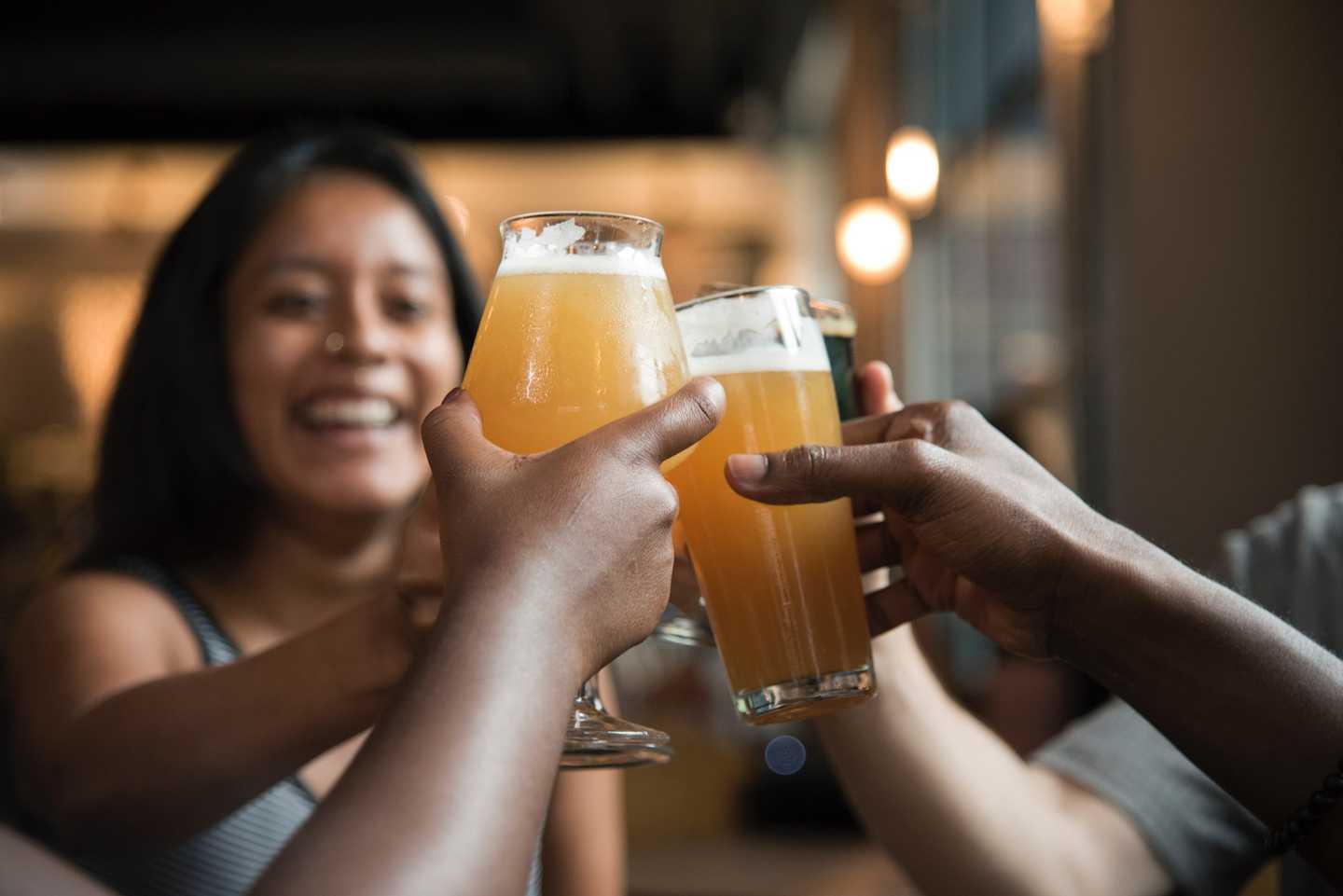 A group of friends cheersing beer