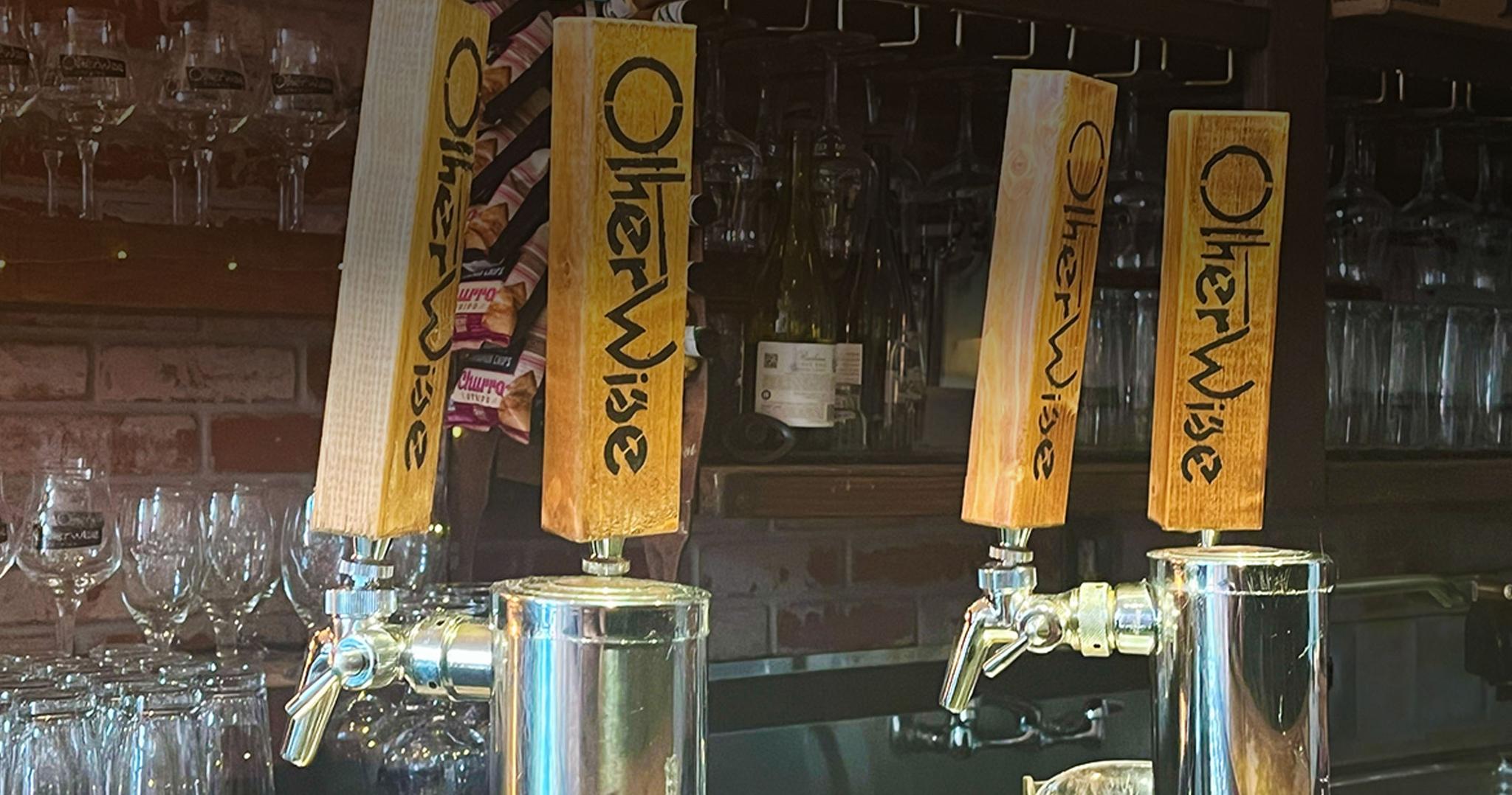A pint of beer being poured from a draft system